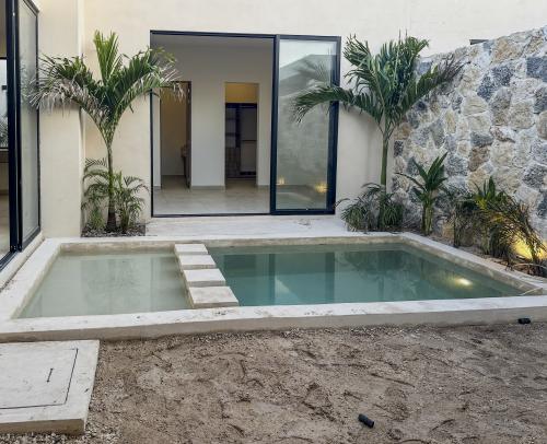1806-52750-Casa-en-venta-de-un-piso-con-2-habitaciones-y-alberca-en-Naia-Residencial-Conkal_(6).jpg