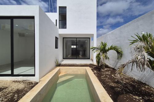 1834-50836-Casa-en-Venta-en-Gran-San-Pedro-Cholul-coN-habitación-en-planta-baja-y-alberca_(14).jpg