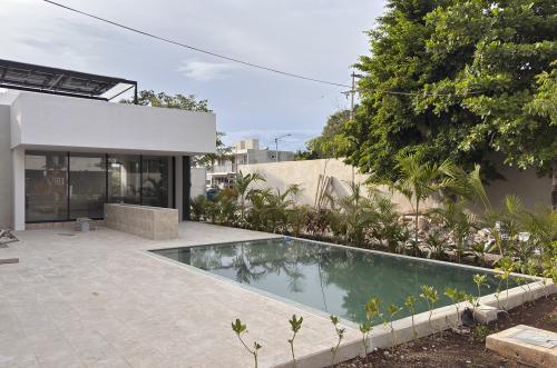 2029-54821-Casa_estilo-Townhouse-en-venta-en-cholul-al-norte-de-Merida-THULA-CITY-HOME__(40).jpg